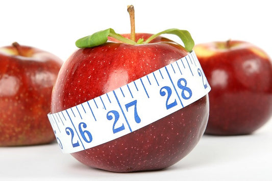 Apples and a measuring tape 